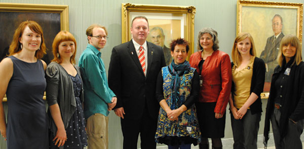 Program Co-ordinator Laura Hale and Provincial Capital Commission Minister Kevin Doherty with the artists chosen for the artist-in-residence program at the Legislative Building. Left to right: Laura Hale, Terri Fidelak, Allan Dotson, Minister Kevin Doherty, Miranda Jones, Heather Cline, Anita Smith, and Sandra Ledingham. Missing: Robert Assie.