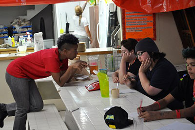 Artist-in-Residence J Mase helps participants express their experiences through poetry