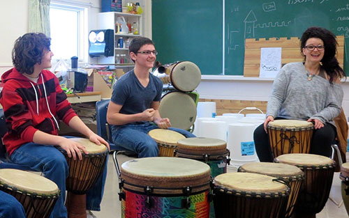 Students drumming at École Notre-Dame-des-Vertus in Zenon Park
