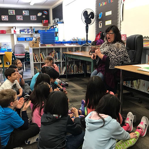 Rhonda Donais tells a story at St. Michael's School in Regina