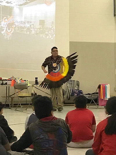Teddy Bison sharing music and storytelling with students at St. Gregory School in Regina