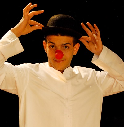 Mustafa Alabssi performs as a clown in Apple Time