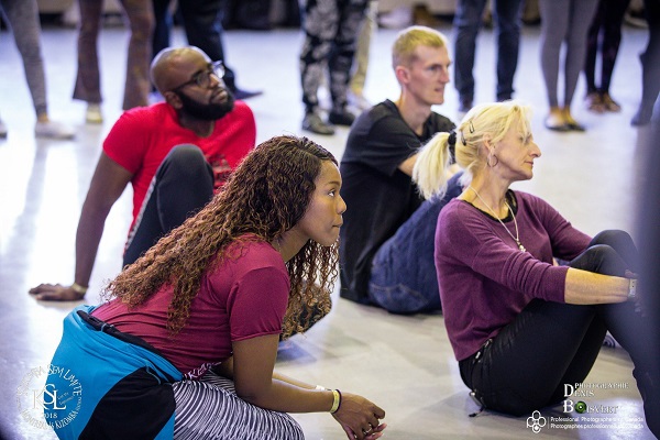Flany Ba sitting with her students
