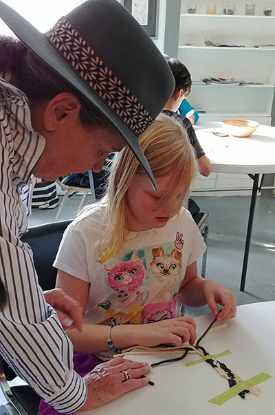 Métis volunteer Darleen Peters from the Miywasin Centre demonstrated and taught Sidney Street School students the art of finger weaving (sash making)