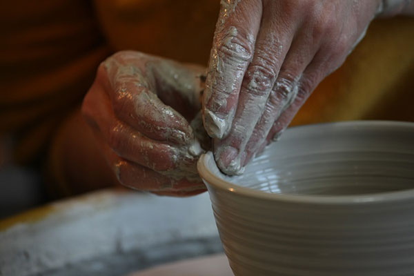 Elaine Angelski works her craft at a pottery wheel