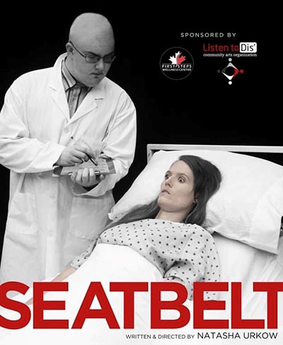 Natasha Urkow lies in a hospital bed with a doctor standing over her in her performance of Seatbelt