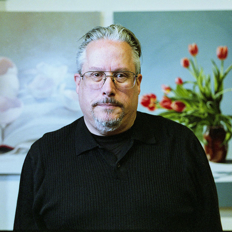 David Garneau - Older man with black and grey hair and beard. He is wearing glassed and a black shirt.