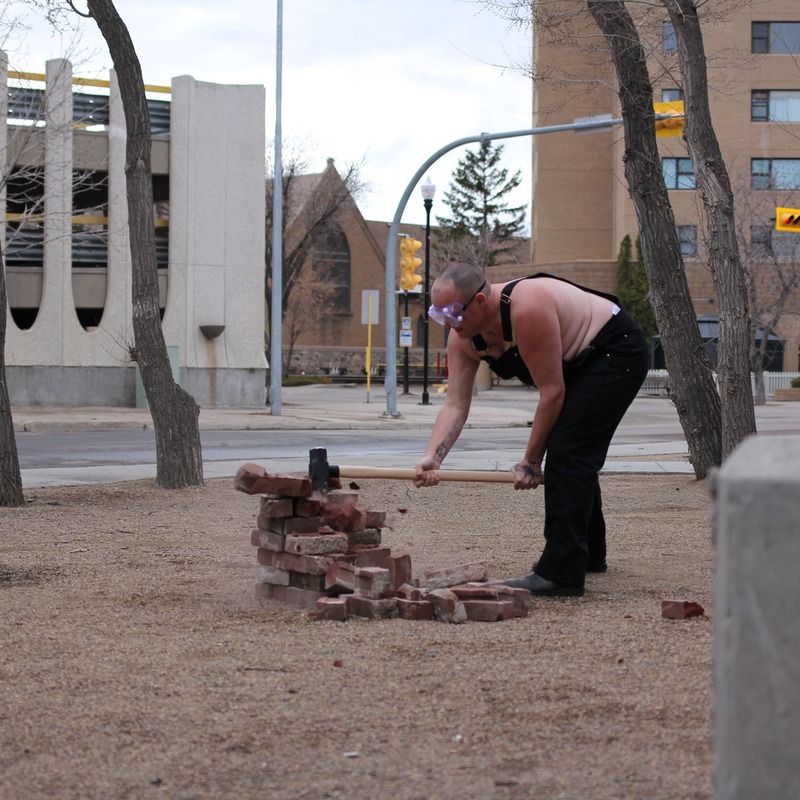 Jaye Kovach - Trans woman smashing bricks in a park