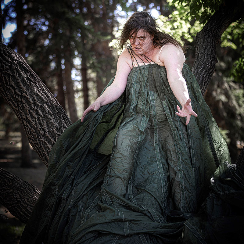 Jackie Latendresse - Photo of dance artists wrapped in a long green dress dancing
