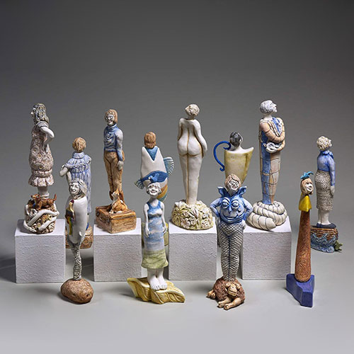 SK Arts Permanent Collection Piece, Art Rental Saskatchewan: Deborah Potter sculpture: 40+ Years in the Making. Product picture of 12 piece scilpture of miniature women ceramicists in Saskatchewan. the picture has a gret background. The scuplture features Karen Dahl, Maria Gakovic, Beth Hone, Ann James, Margaret Keelan, Marilyn Levine, Sandra M. Ledingham, Jeannie Mah, Lorraine Malach, Anne McLellan, Wendy Parsons, Deborah Potter, and Anita Rocamora.